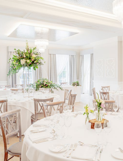 Elegant event space for Christmas parties in Old Palace Chester with floral decor.