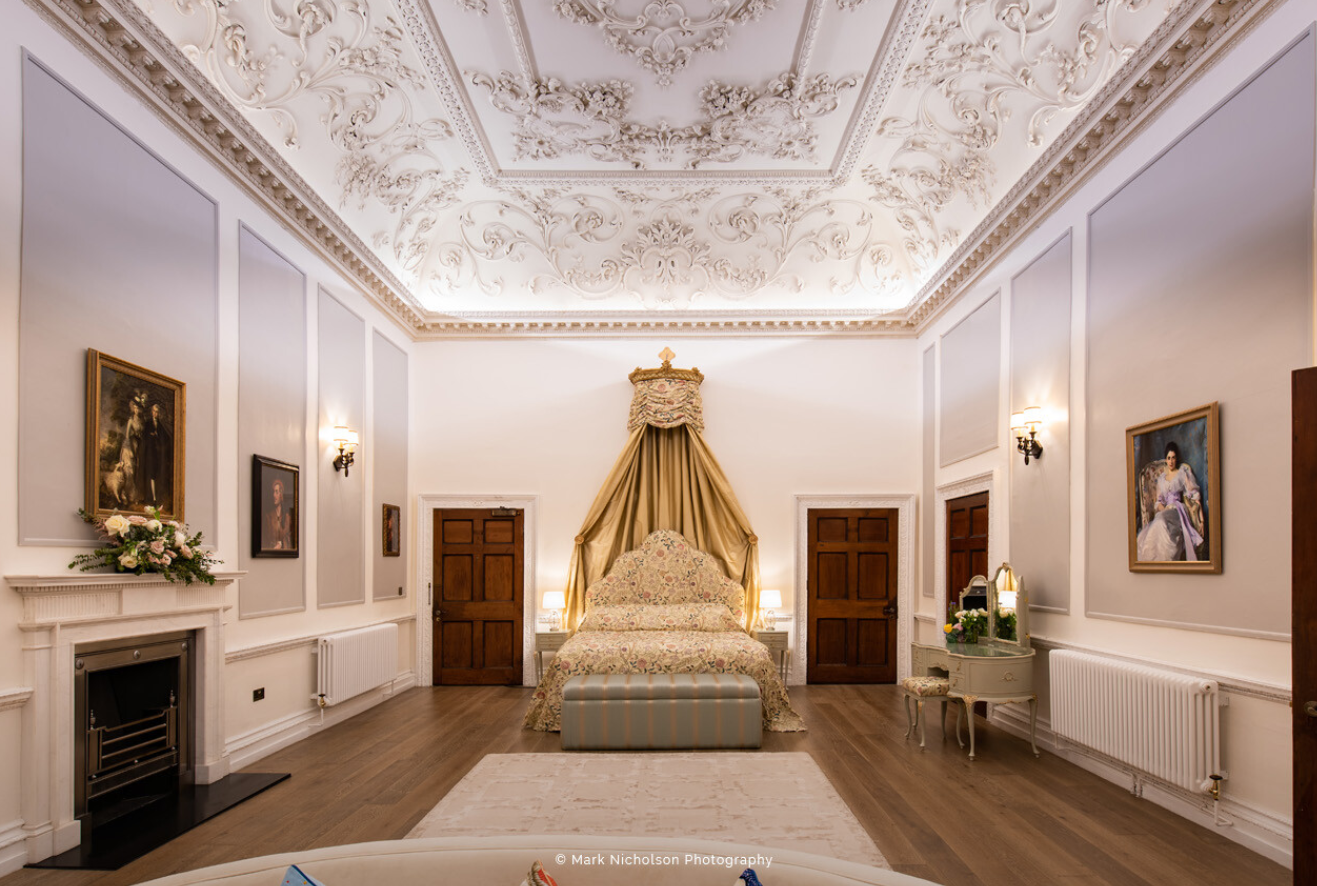 Elegant wedding venue with ornate ceiling at Old Palace Chester, perfect for upscale events.