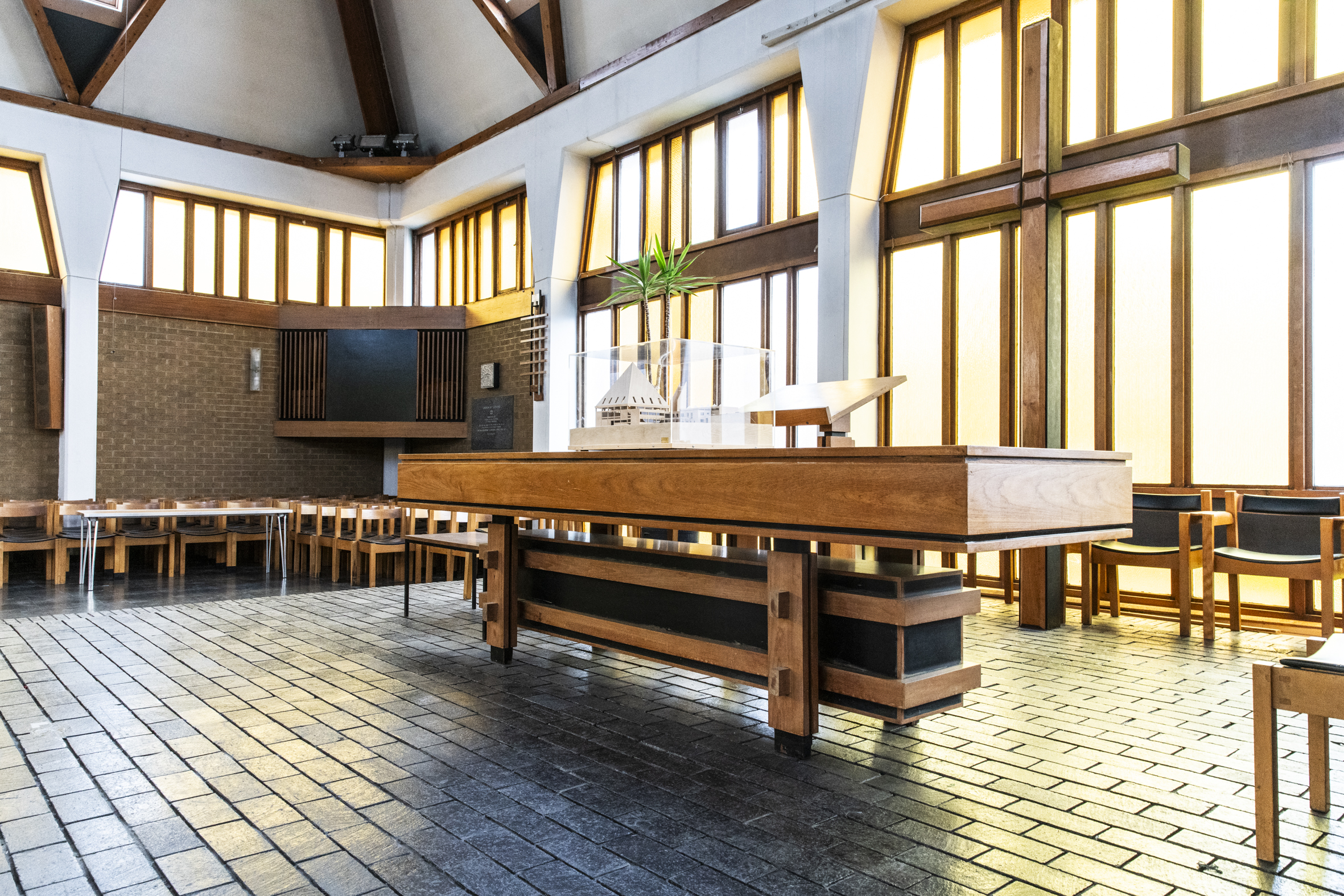 Pyramid Hall venue with high ceilings and warm wood accents, ideal for events and meetings.