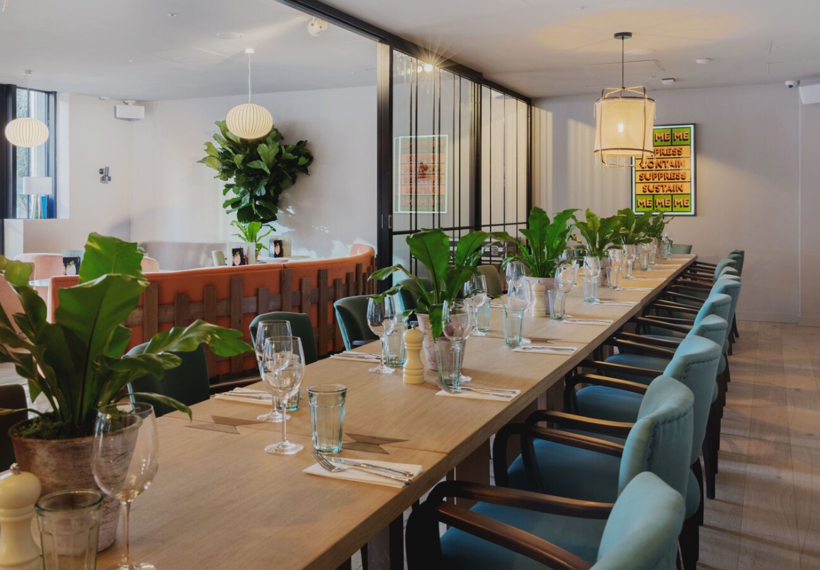 Elegant communal dining table for upscale corporate board dinners and boutique event hire.