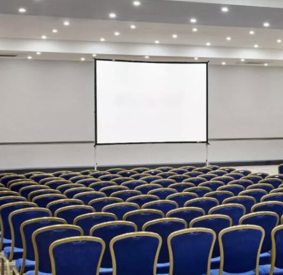 Conference room in Paris Suite, Leonardo Hotel: blue chairs, ideal for presentations.