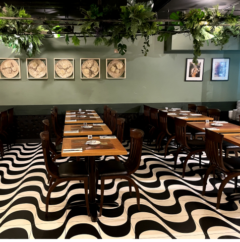 Rodizio Rico restaurant with bold graphic flooring for corporate networking and group lunches.