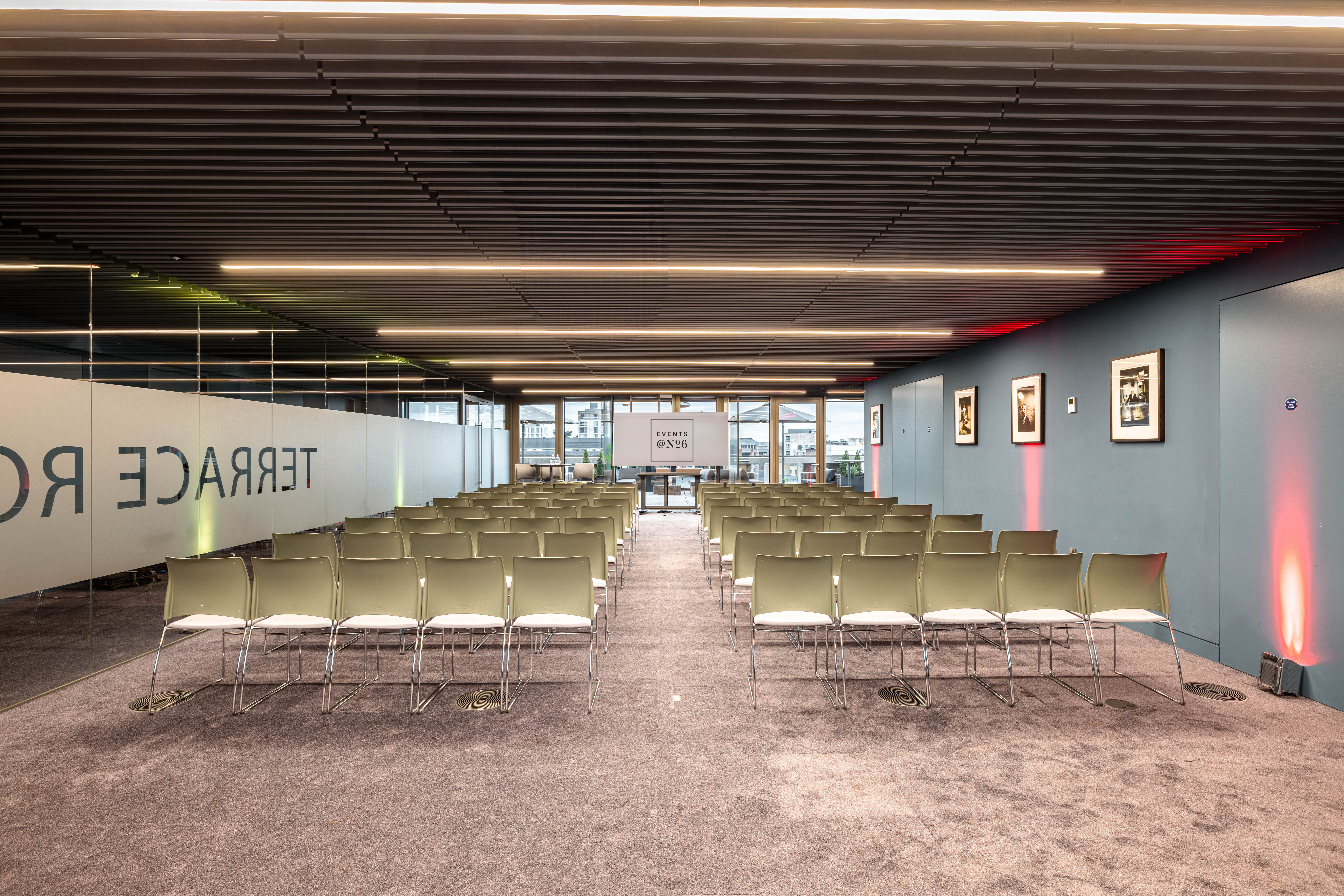 Summer Party Rooftop event space with modern seating and natural light for networking.