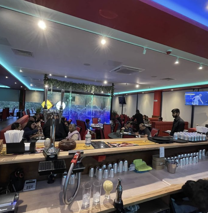 Sankalp restaurant event space with booth seating for corporate networking and social receptions.