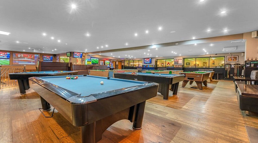 Spacious billiards hall at Bar 50, ideal for networking and team-building events.