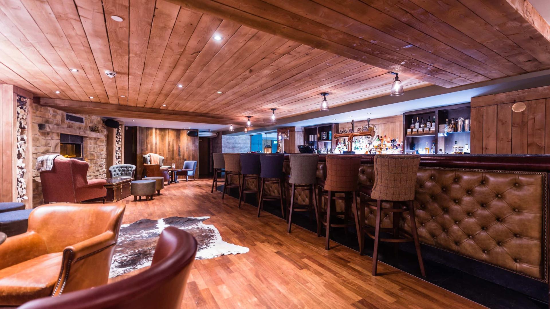 Function room at Bar 50 with cozy seating, perfect for networking events and gatherings.