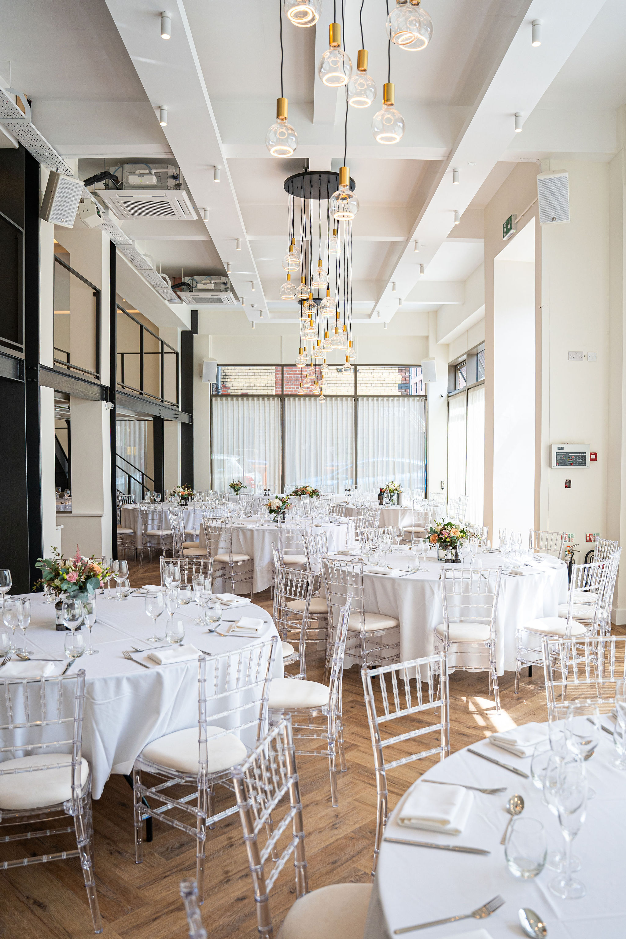 The Clubhouse at Ropewalks Hotel: Modern gala wedding venue with floor-to-ceiling windows.