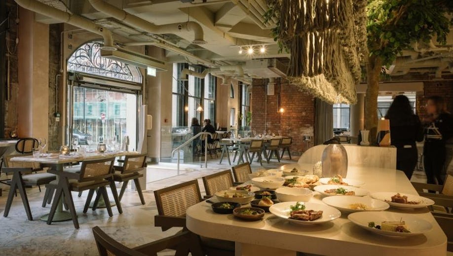 Stylish restaurant dining space with modern decor for intimate events and meetings.