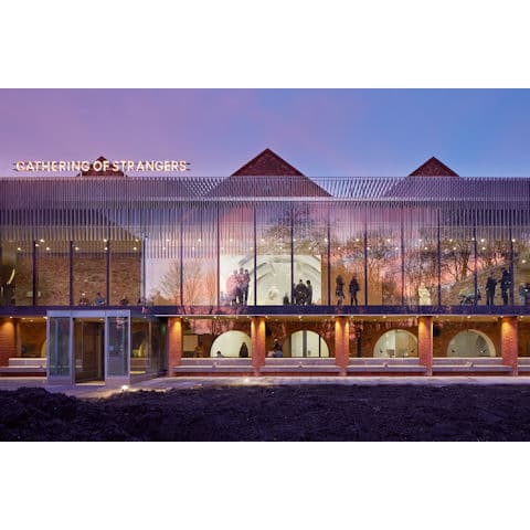 The Whitworth venue: historic brick and glass architecture for sophisticated evening receptions.