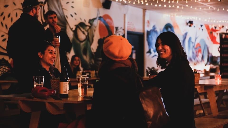 Vibrant GRUB MCR venue with warm lighting for networking events and casual meetups.