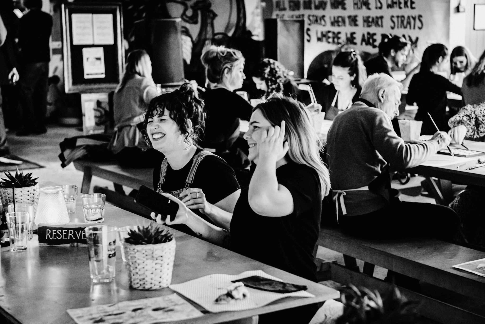 Vibrant GRUB MCR dining room with communal tables for networking events and collaboration.