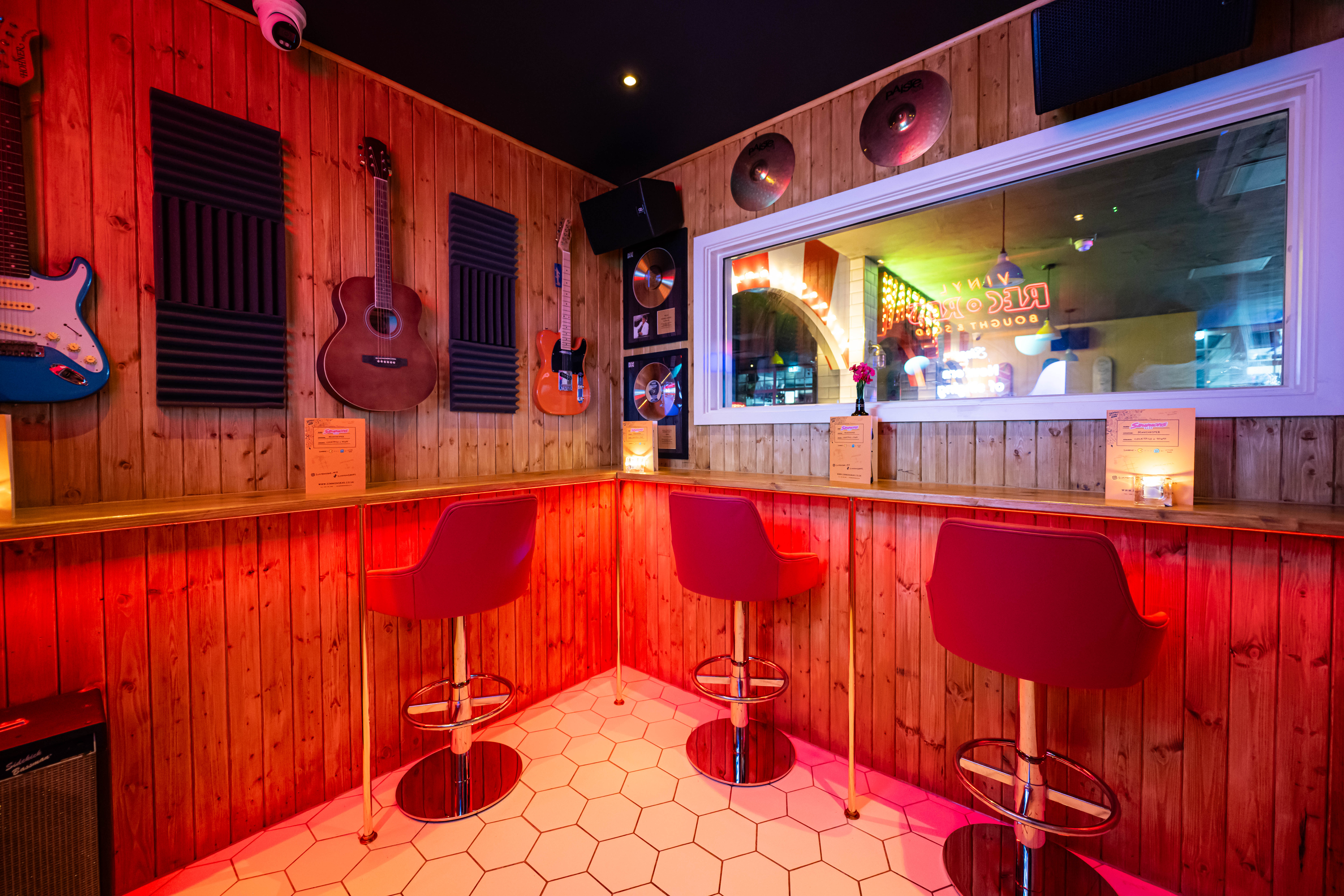 Cozy karaoke room in Simmons Manchester, perfect for social mixers and casual gatherings.