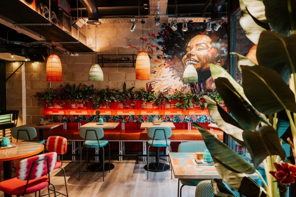 Private dining area with colorful decor for casual meetings and social events in Turtle Bay.