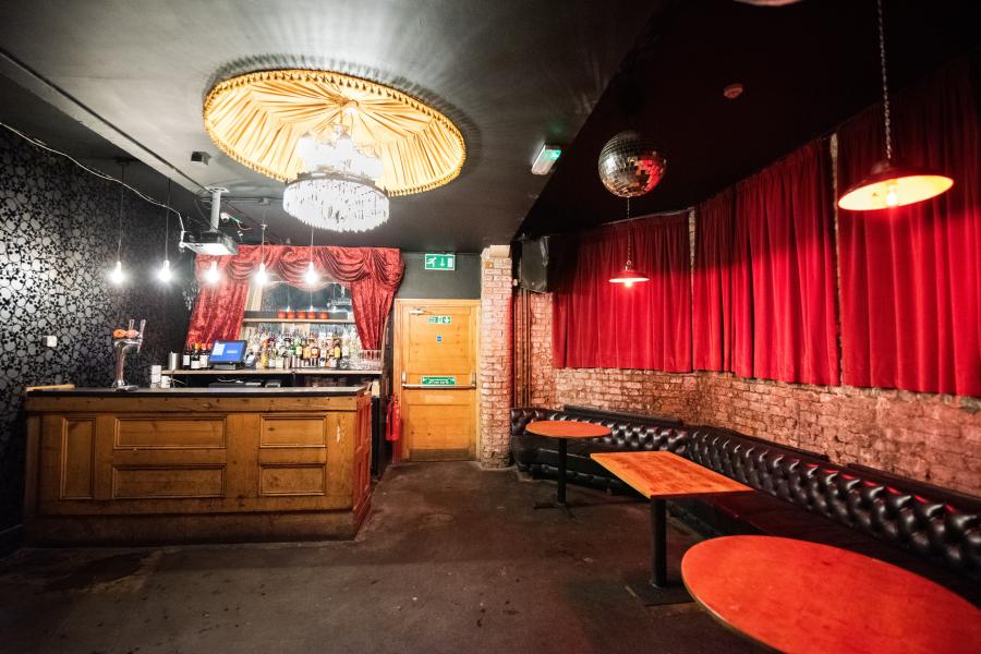 Stylish lodge at The Deaf Institute with elegant chandelier, perfect for events and parties.