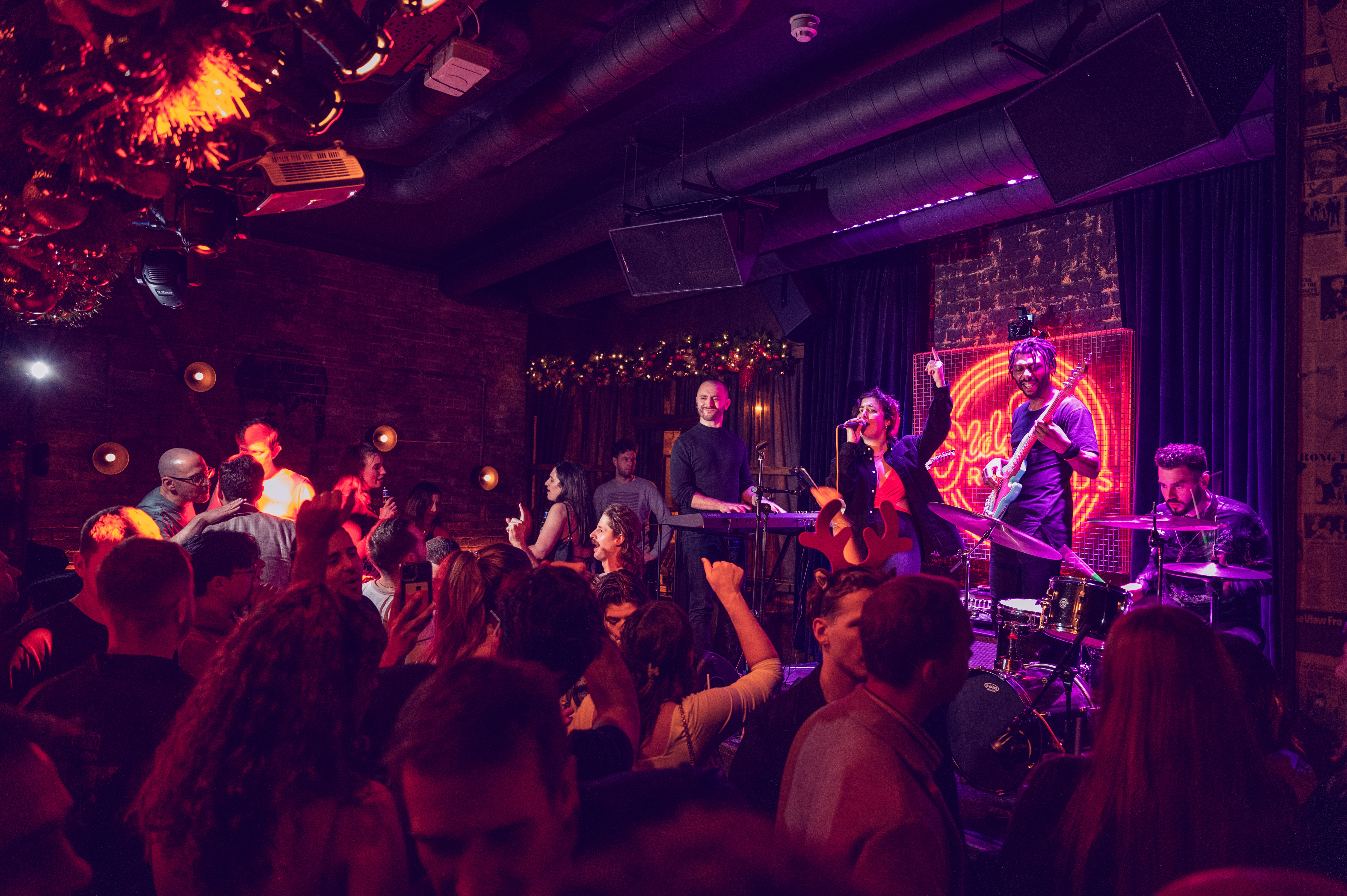 Vibrant live music event at Old Street Records with engaged audience and warm lighting.