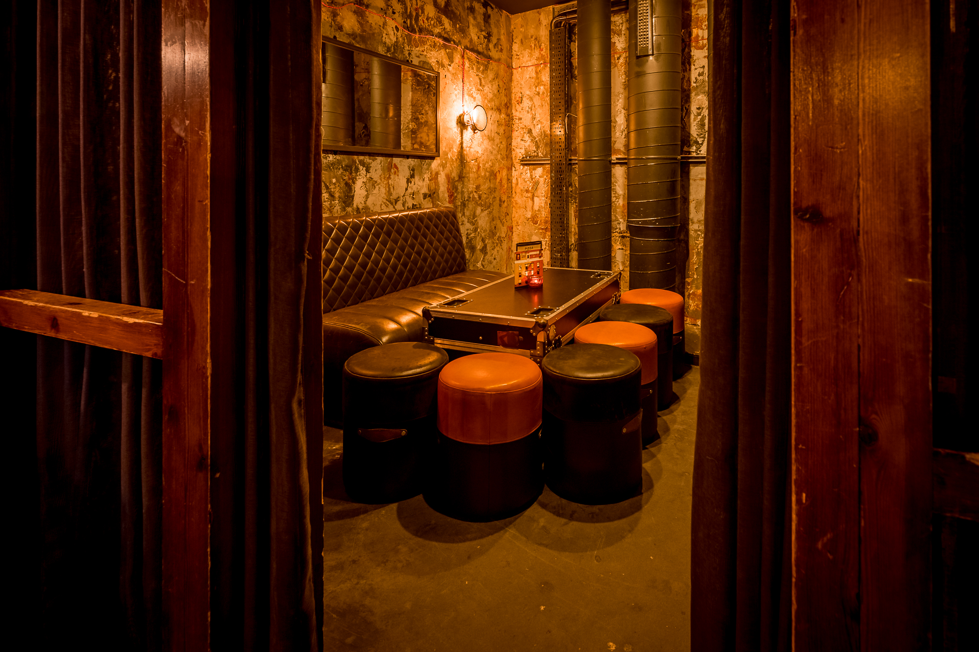 Cozy meeting space at Old Street Records with plush couch, ideal for creative events.