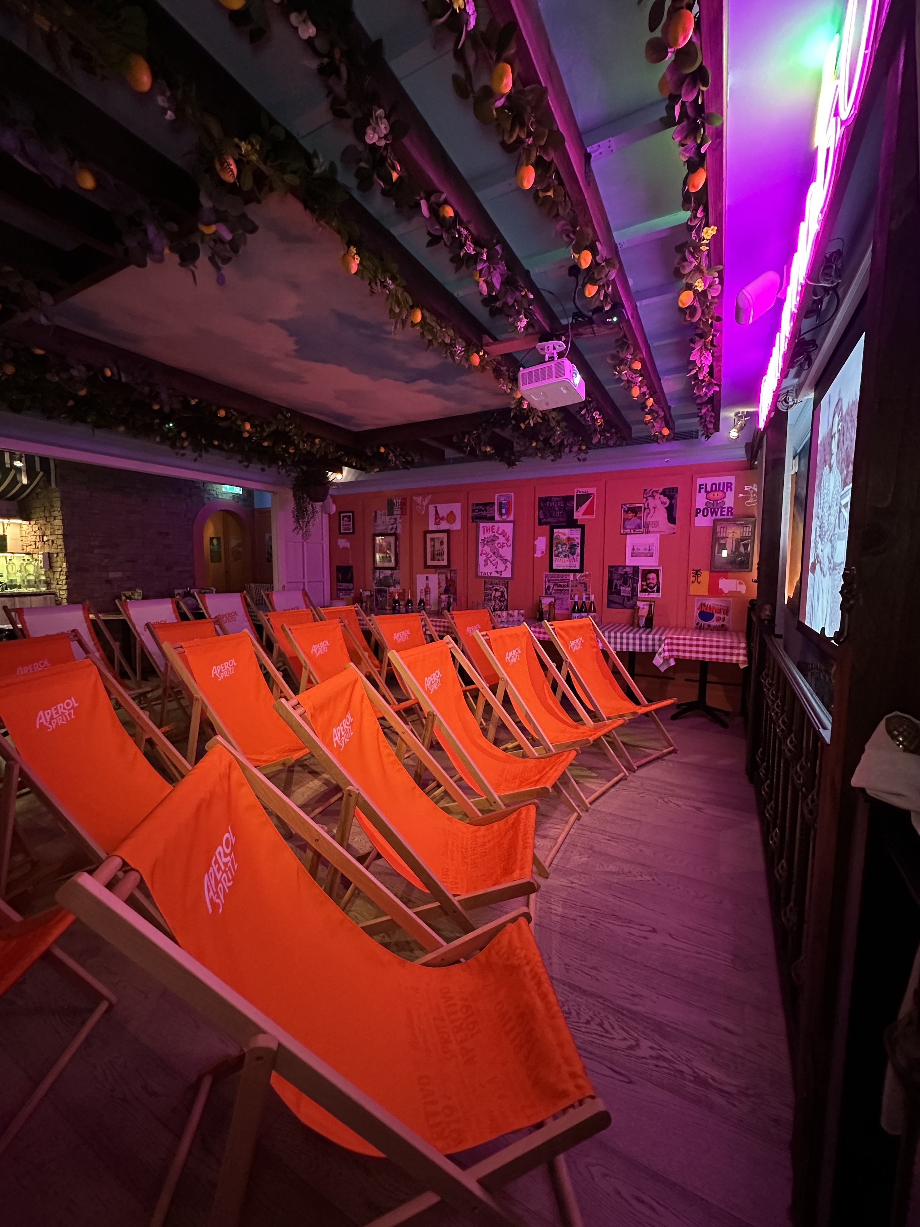 Branded deck chairs at Cinema Paradiso pop-up, experiential event, themed cinema activation.