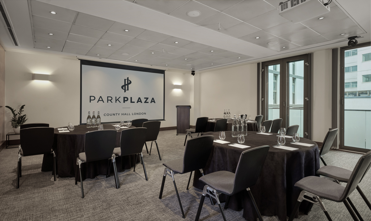 Millennium Suite at Park Plaza: modern meeting room with natural light for corporate events.