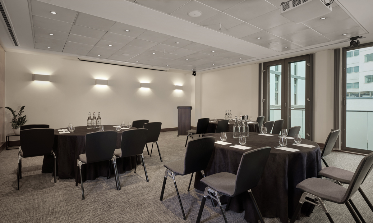 Battersea Suite meeting room with round tables, ideal for professional events and workshops.