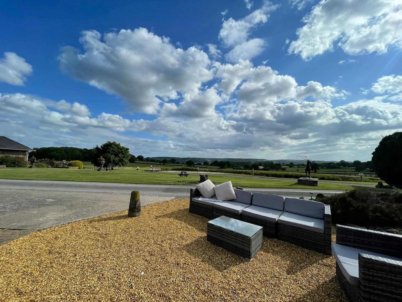 Barn conversion venue with scenic views, ideal for corporate retreats and outdoor networking events.