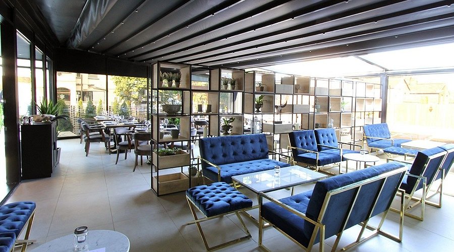 Lokkum Bar & Grill lounge with luxe seating and retractable roof for corporate events and receptions.