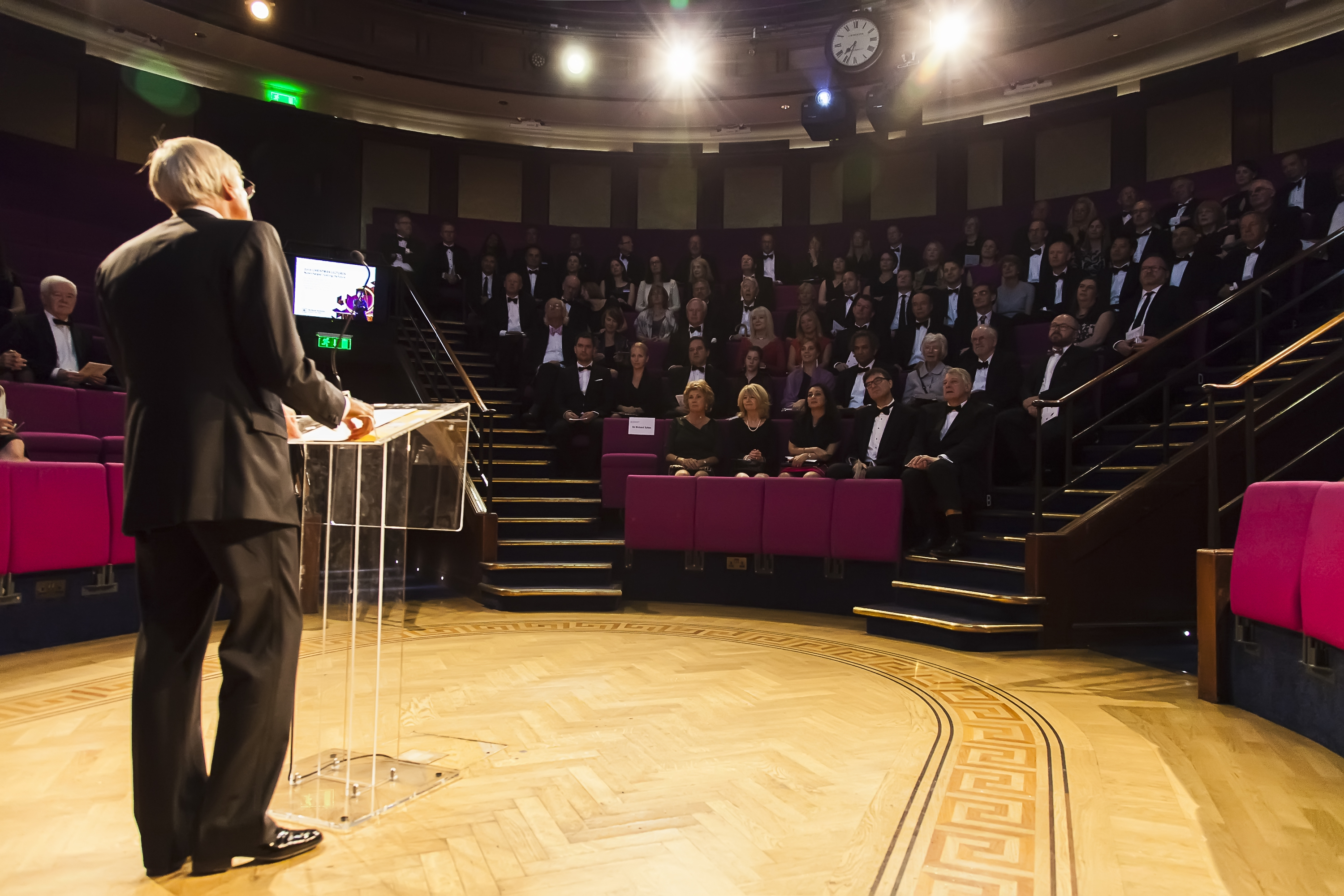 Elegant tiered auditorium at Royal Institution for formal events and lectures.