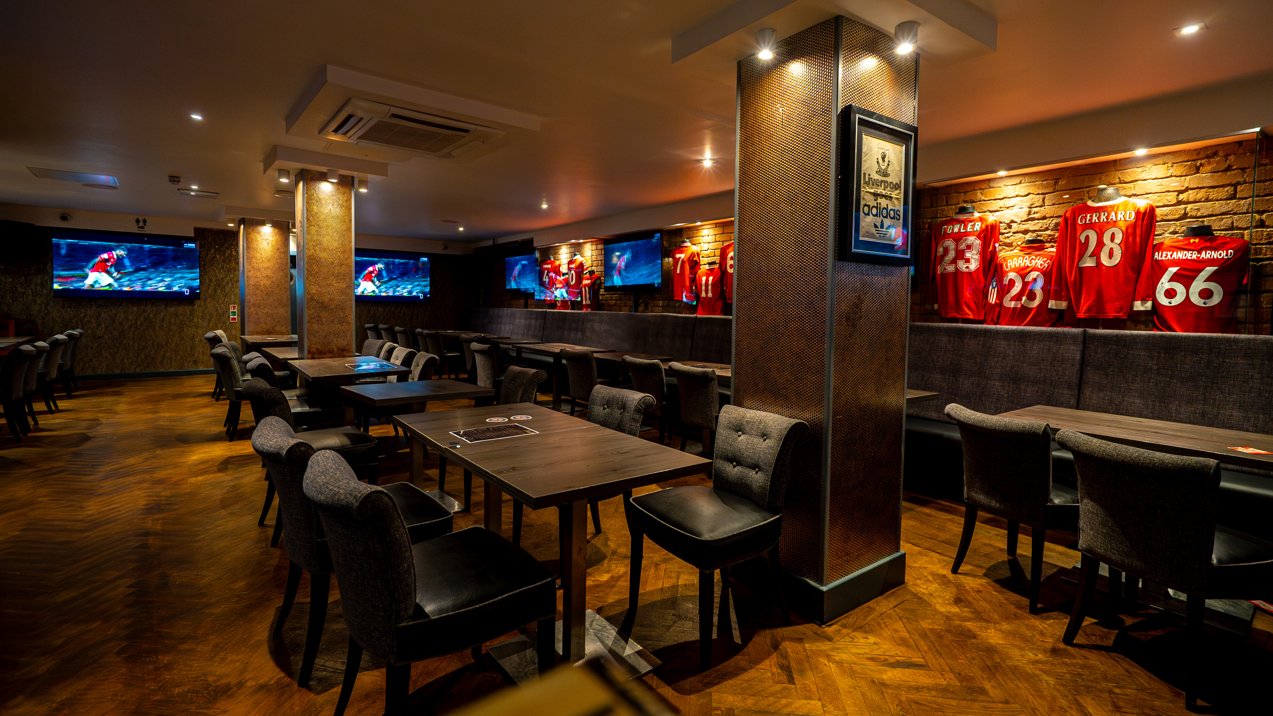 Reds Liverpool sports bar with modular tables for corporate networking and team-building events.