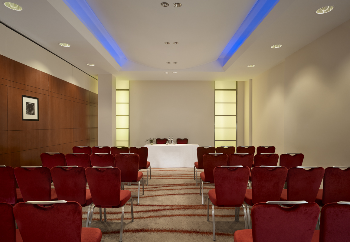 Albert Suite meeting room at Park Plaza Victoria, featuring red chairs for corporate events.