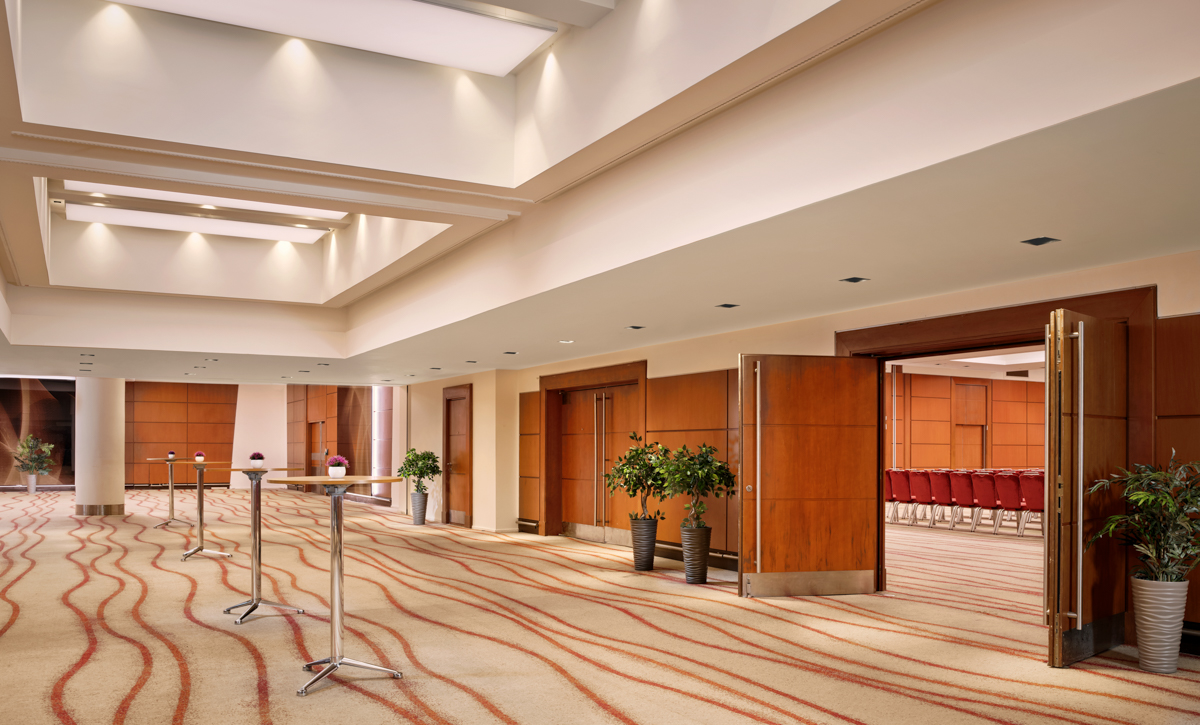 Beatrice Suite at Park Plaza Victoria: modern event space with elegant wooden doors.