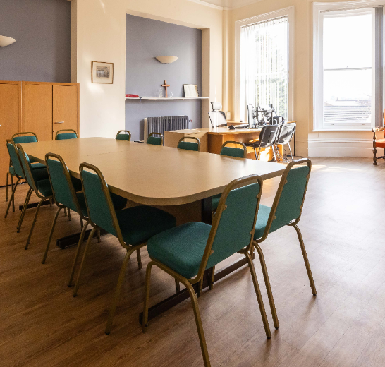 Boardroom at The Village, naturally lit meeting space for professional corporate events.