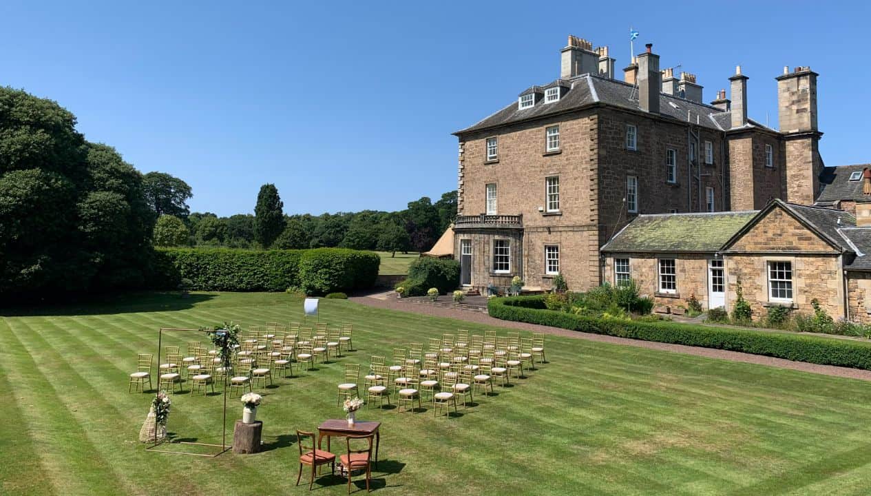 Gilmerton House gardens with gold seating for wedding ceremonies and corporate events.