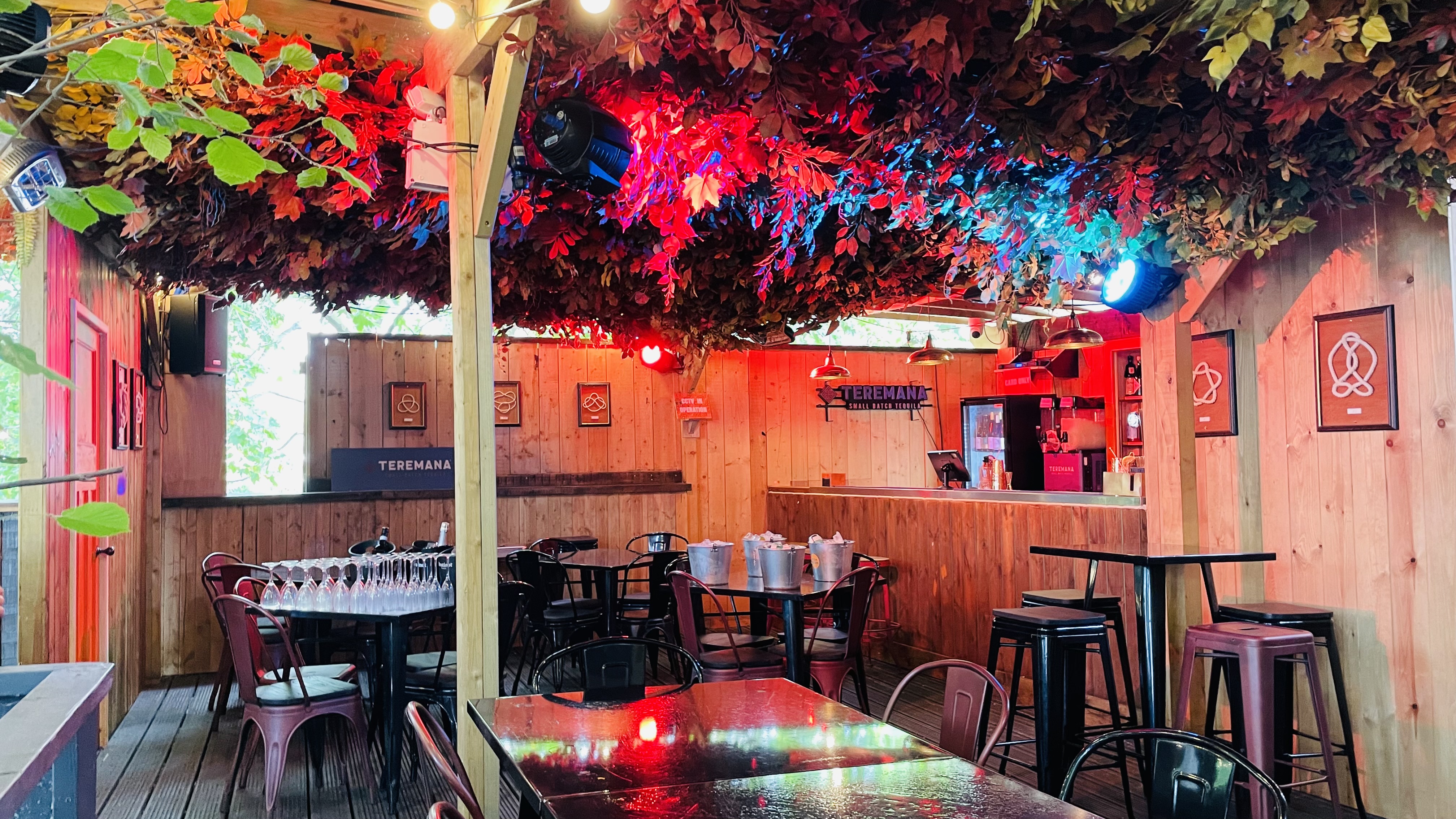 Cozy rustic event space at The Knot in Between The Bridges, ideal for gatherings and meetings.