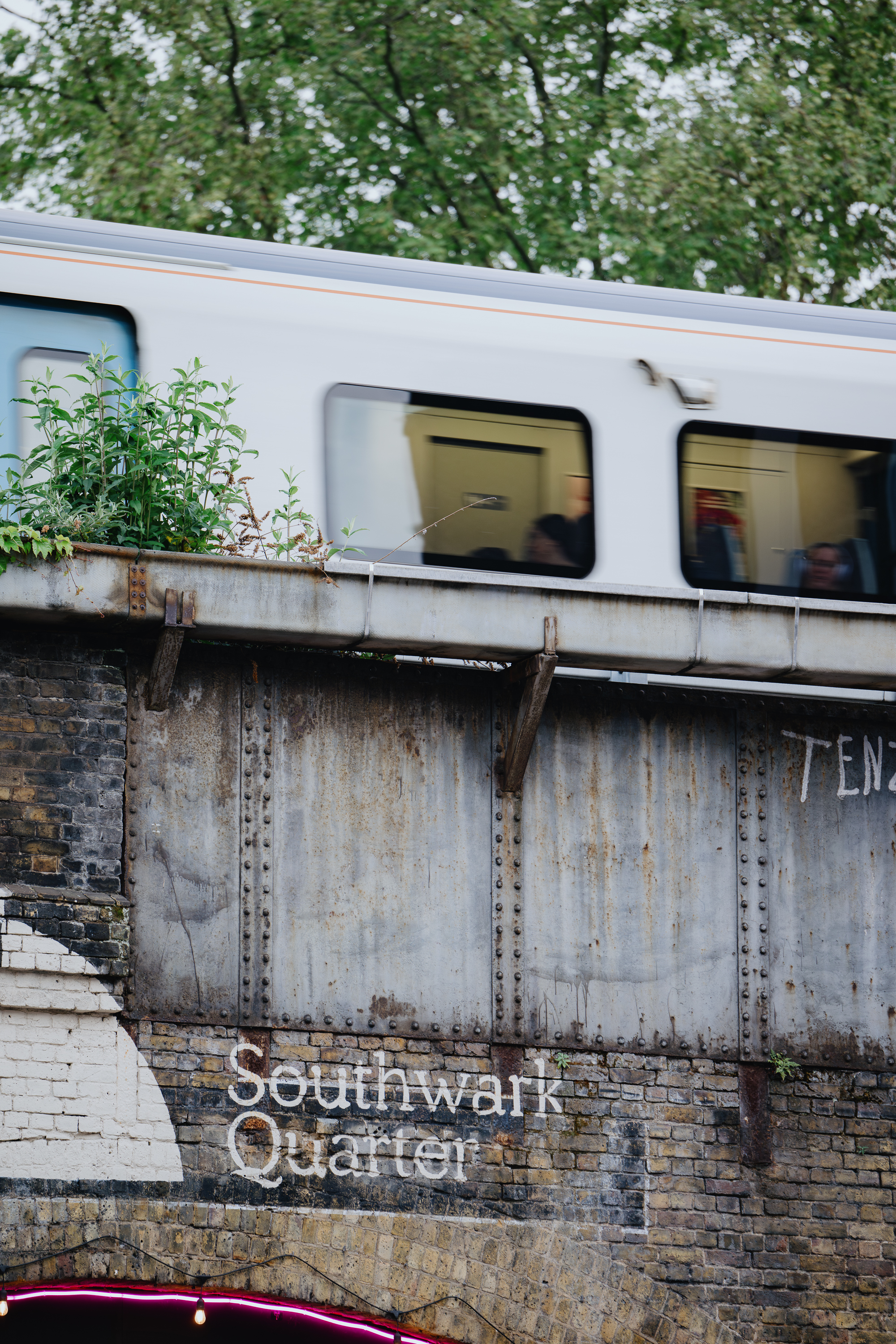 Urban Pyro Terrace with a train overhead, perfect for city-themed events and networking.