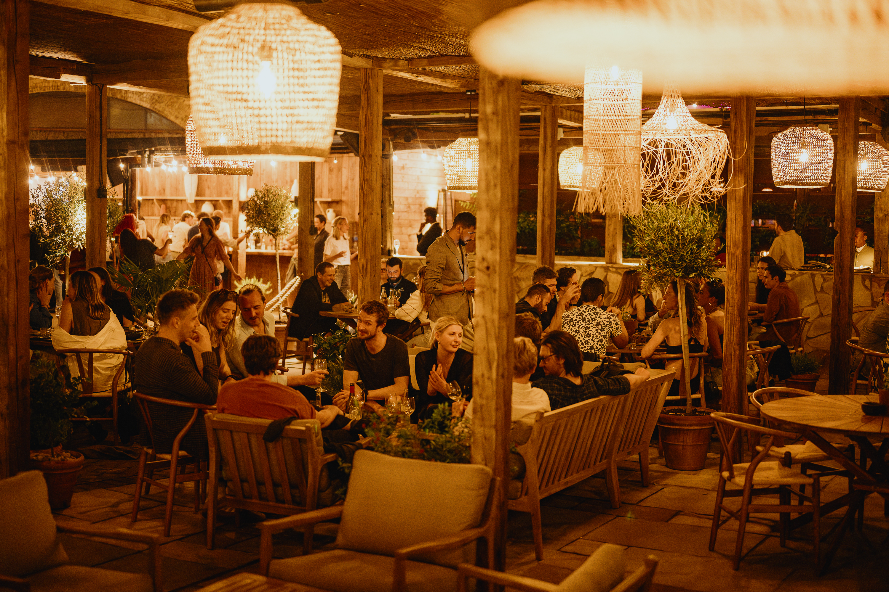 Vibrant Pyro Terrace event space with warm lighting for social gatherings and networking.