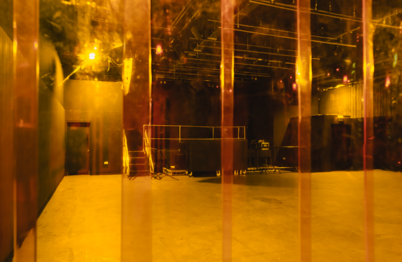 "Modern event space in Ambers Club with textured paneling, perfect for gatherings."