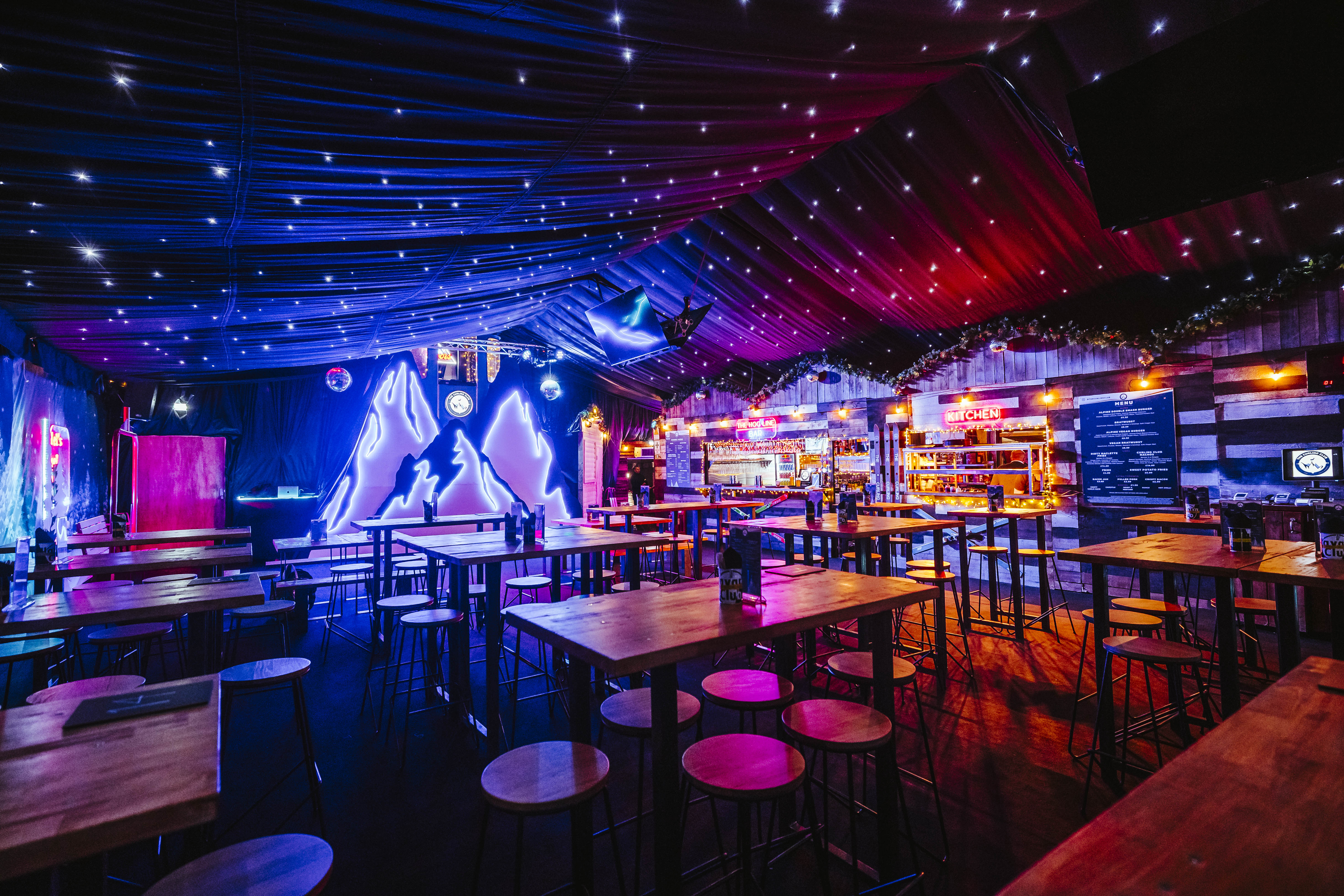 Curling Club Manchester: Neon-lit pop-up venue for winter networking and corporate social events.