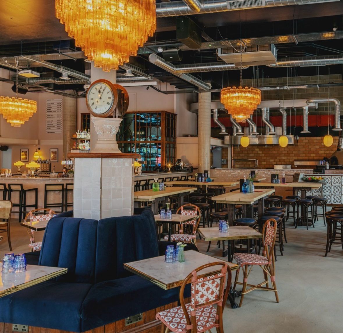 Industrial-chic Teatro Hall venue with statement lighting for networking and conference events.