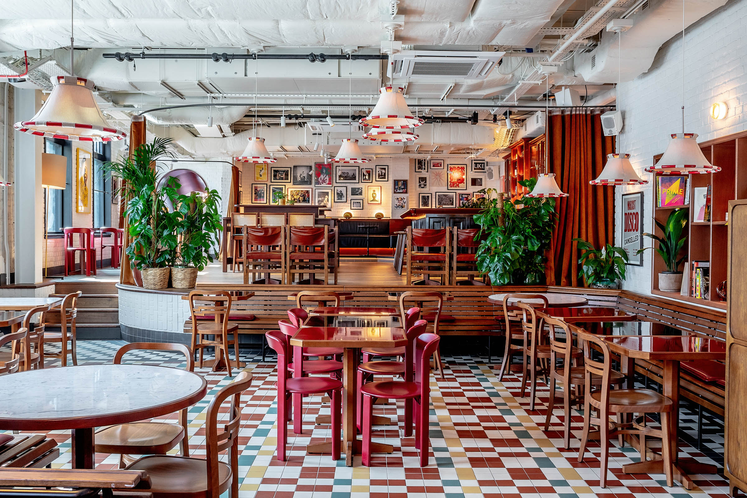 Vibrant Cafe KOKO with greenery, ideal for meetings and social events.