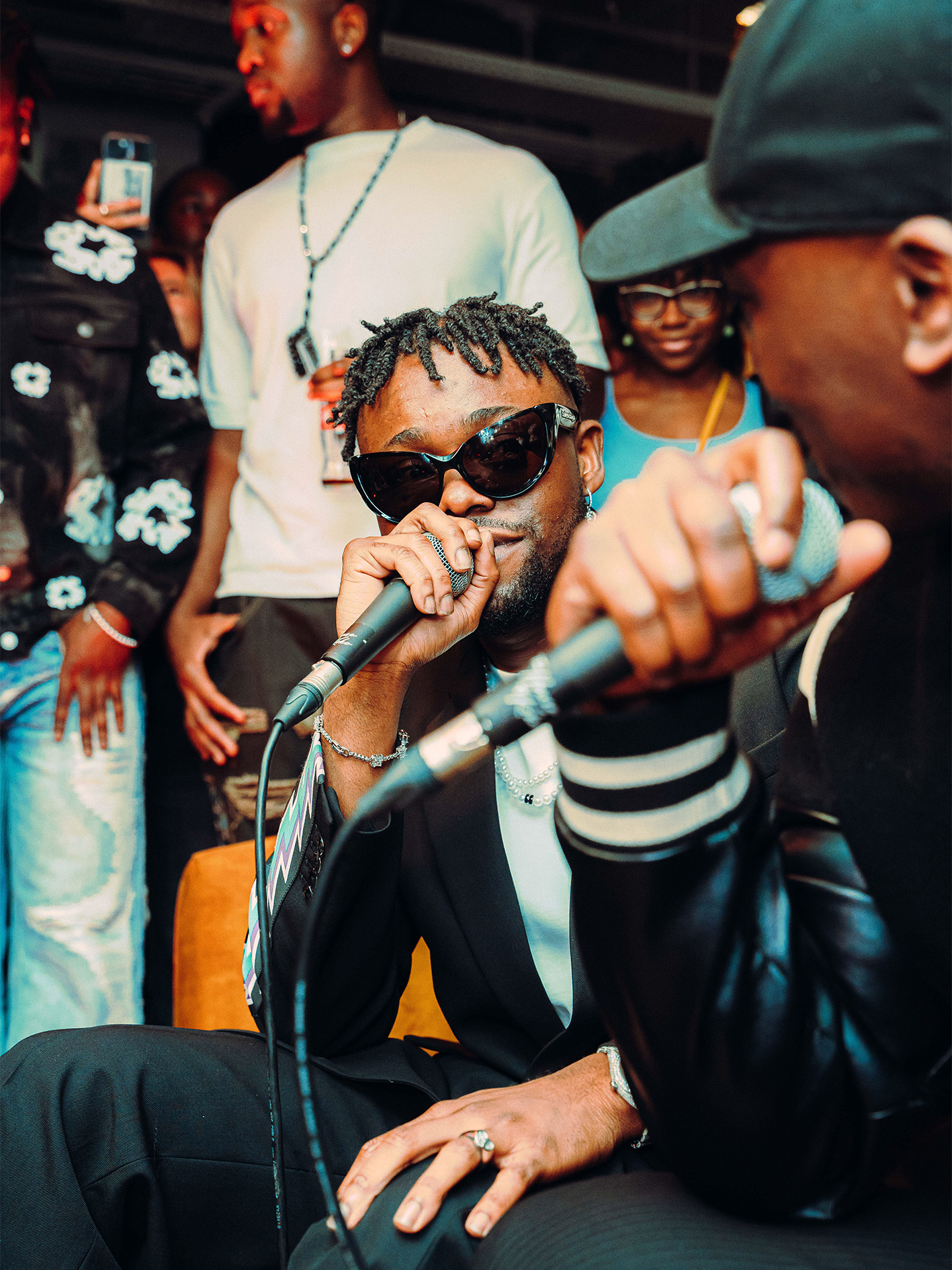 Vibrant live performance at Cafe KOKO, showcasing dynamic artist and engaged crowd.