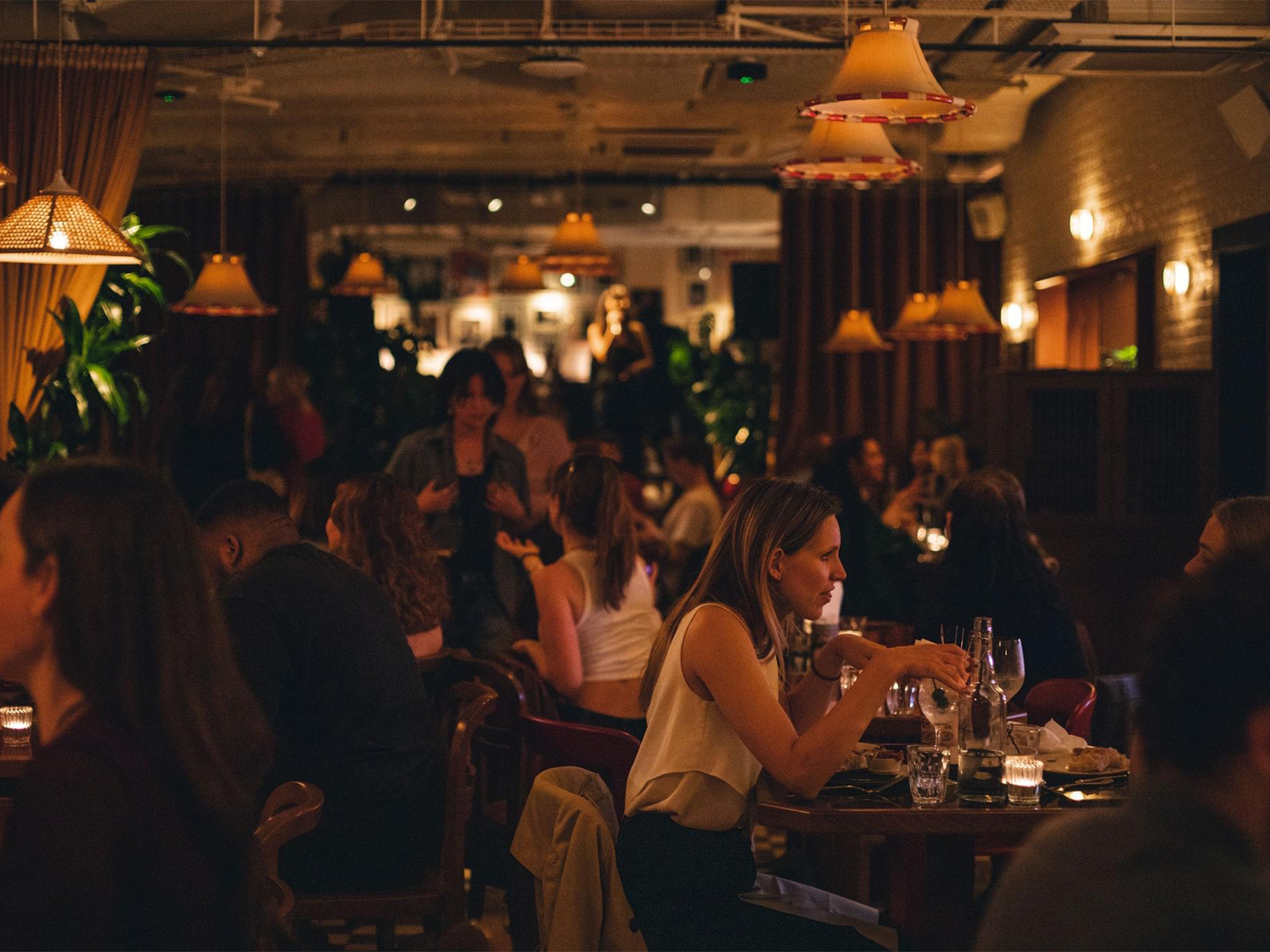 Vibrant Cafe KOKO with warm lighting, ideal for networking events and social gatherings.