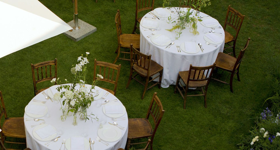Elegant outdoor dining setup at The Norfolk Garden, perfect for upscale events.