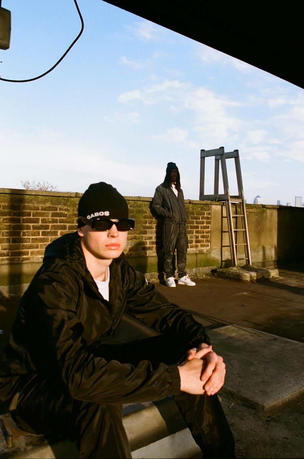 East London Rooftop with stylish streetwear models for fashion events or photoshoots.