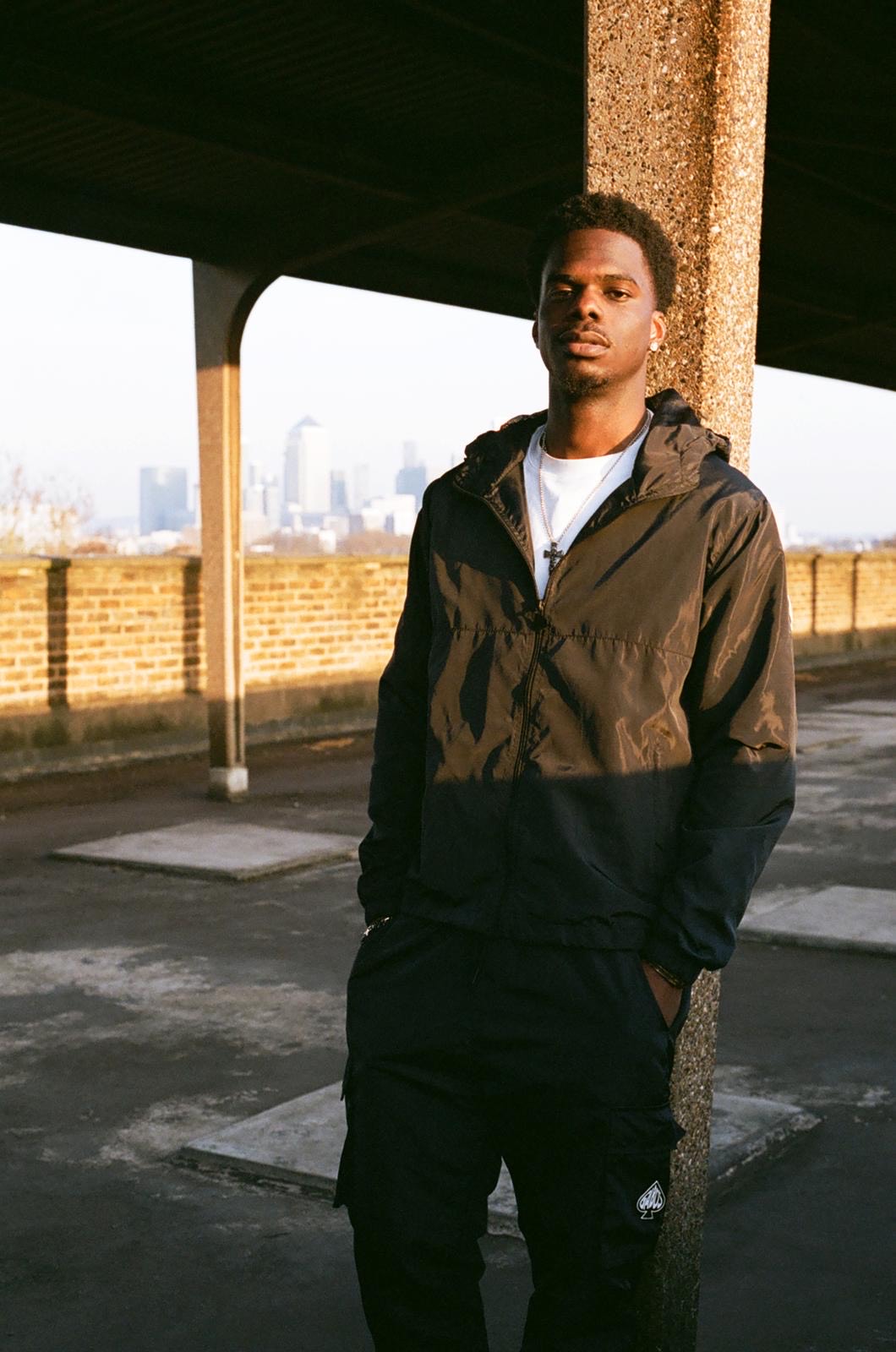 Stylish young man at East London Rooftop, ideal for urban events and photoshoots.