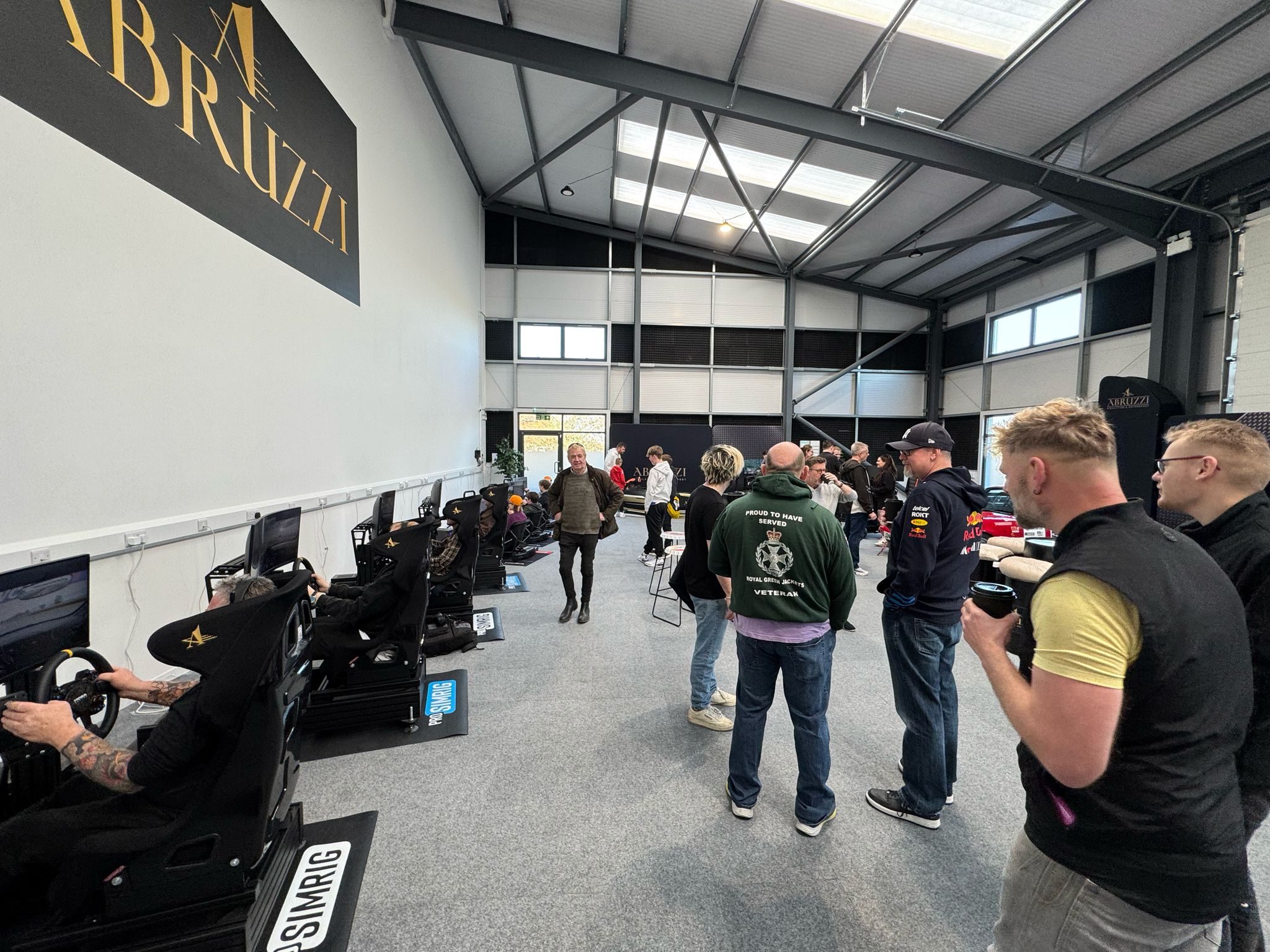 Abruzzi Sim Racing showroom with high-tech simulators for corporate team-building event.