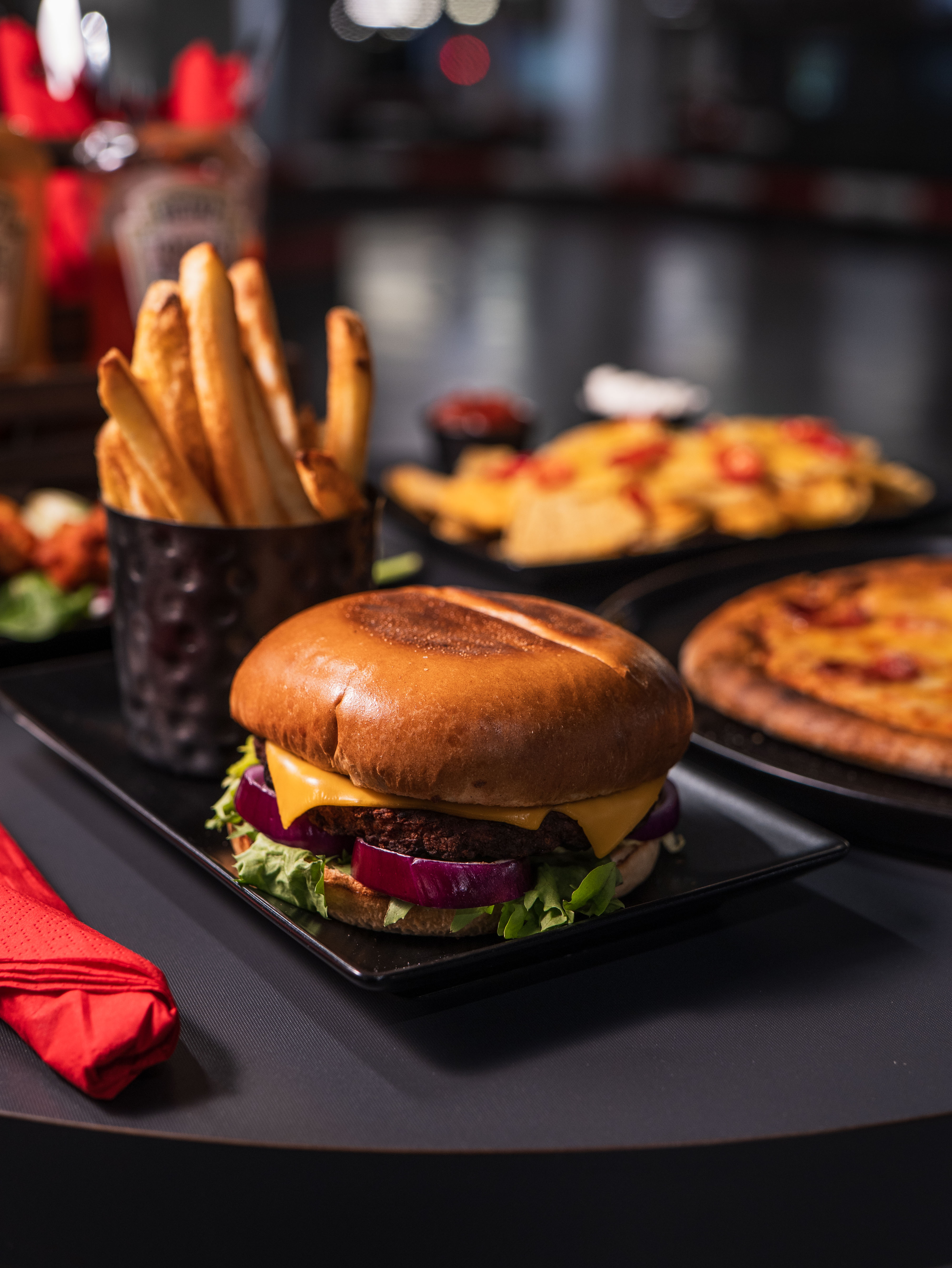 Juicy burger and fries at K1 Speed Canary Wharf for casual networking events.
