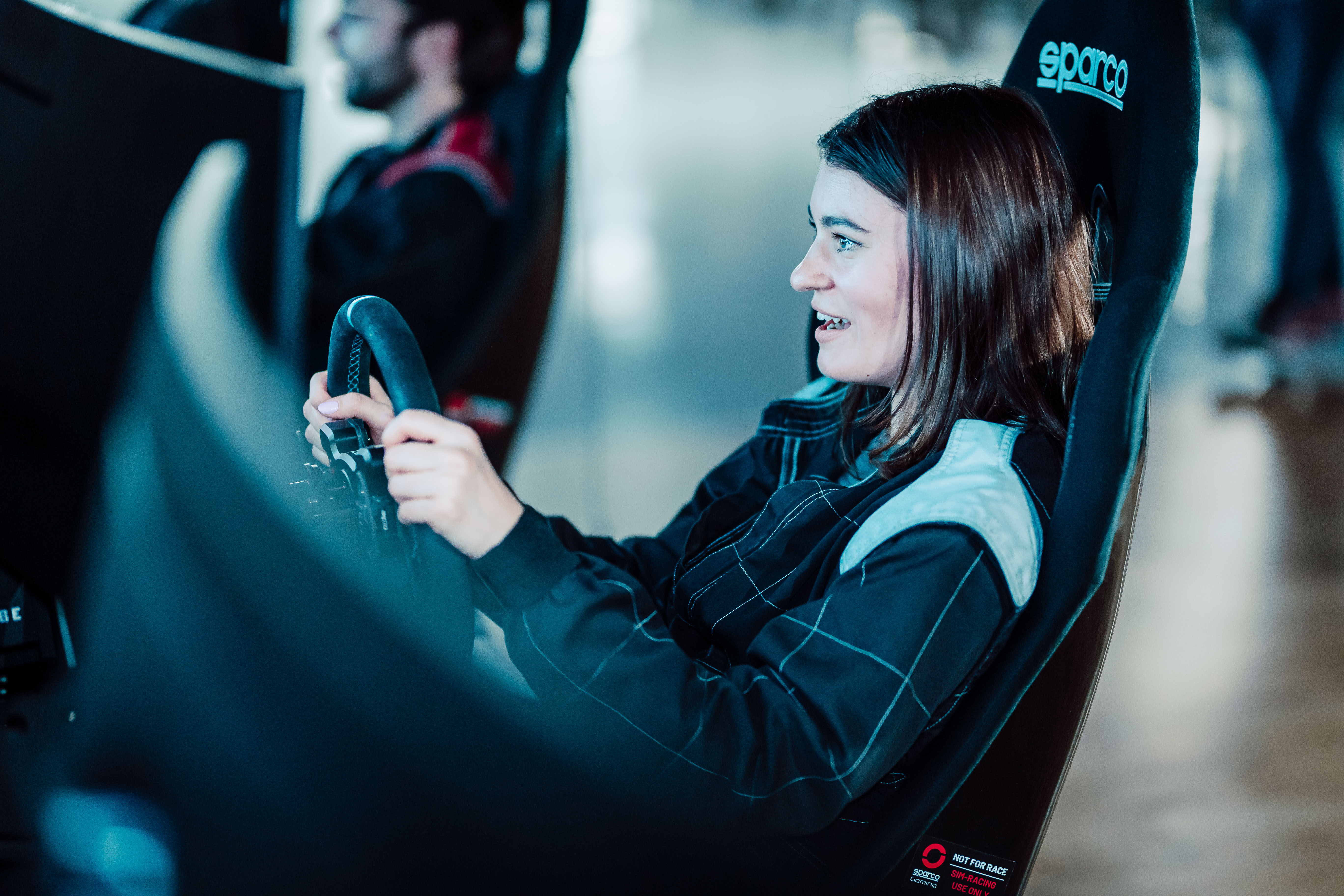 "Race Lounge simulator at K1 Speed Canary Wharf for corporate team-building events."