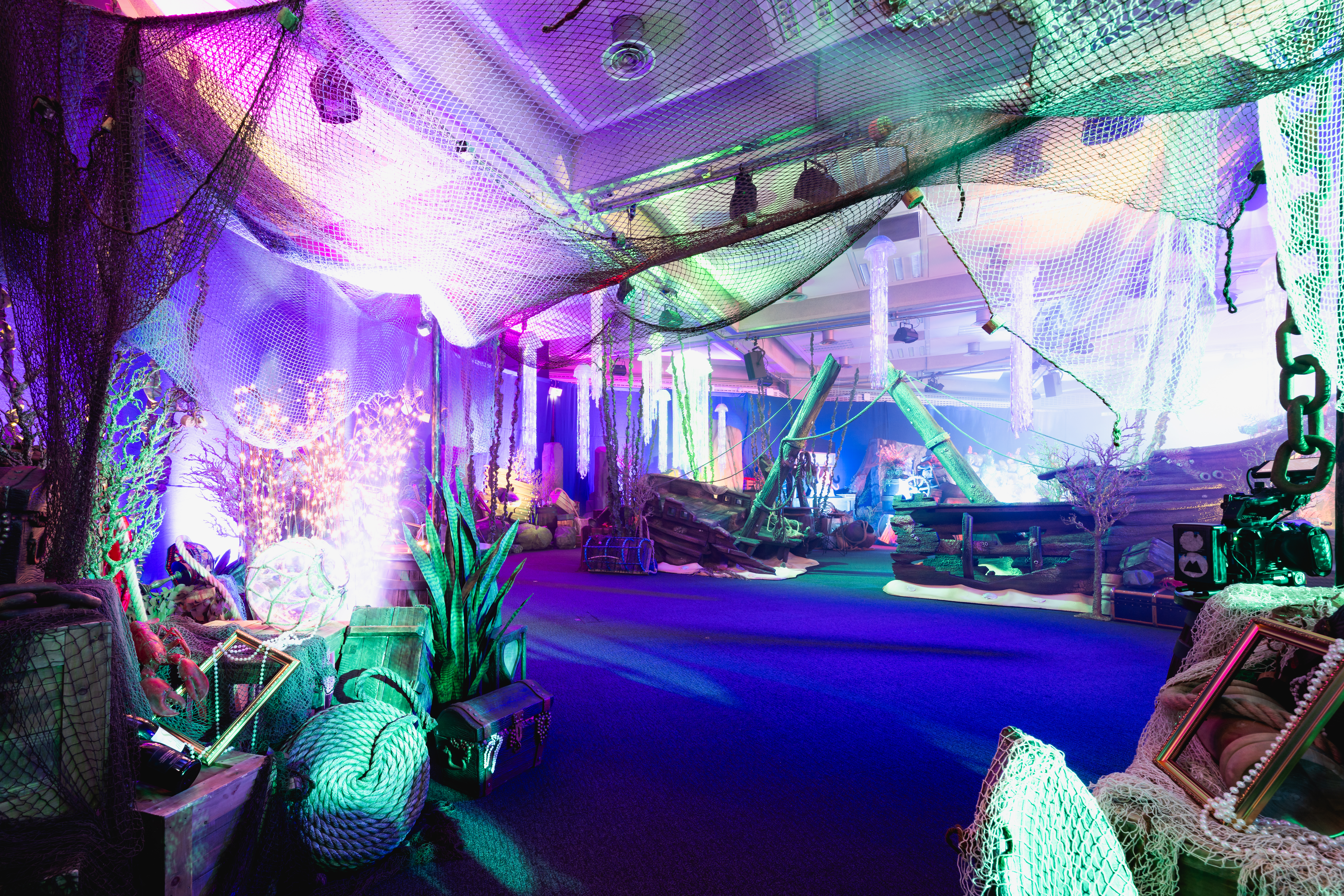 Vibrant underwater-themed event space at QEII Centre, perfect for celebrations.