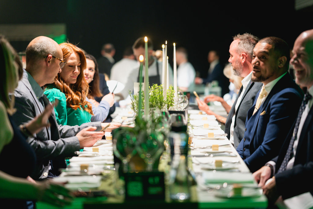 Elegant banquet setup with fine china for corporate networking event at QEII Centre.