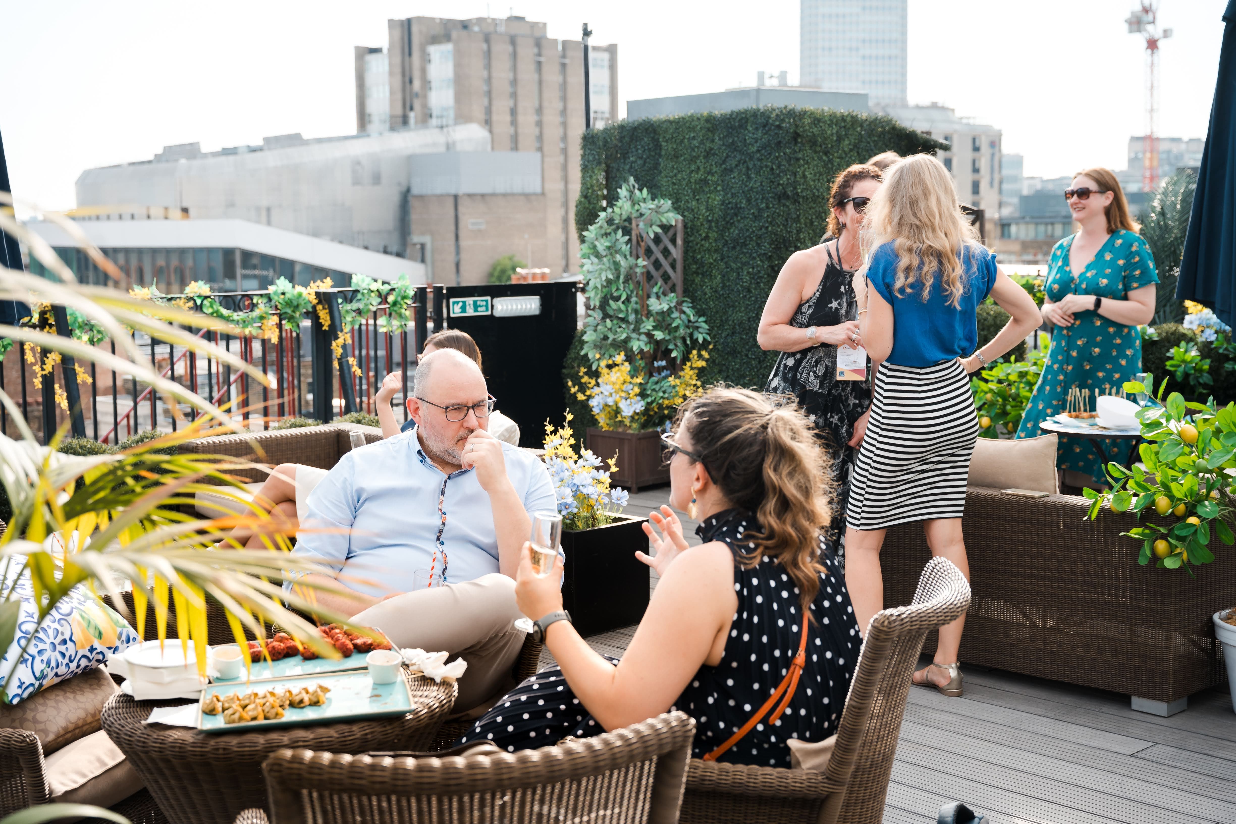 Penthouse roof terrace with lounge seating for corporate networking and social events.