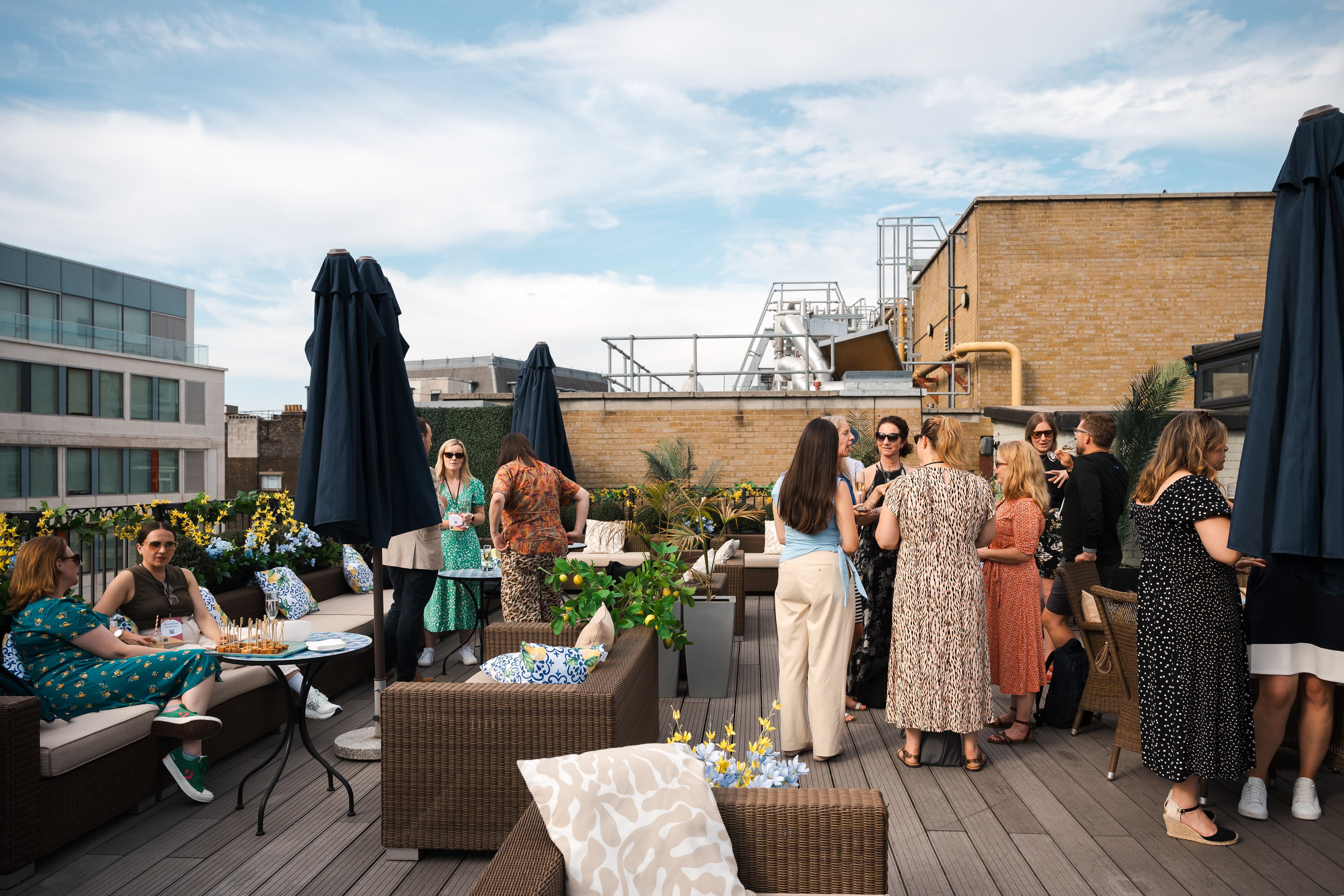 Penthouse rooftop terrace with lounge seating for networking receptions and corporate events.
